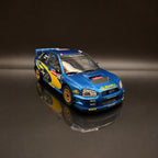 Subaru Impreza WRC S9 – Rally de Gran Bretaña 2003 #7 Petter Solberg Escala 1:12 de OTTOmobile
