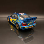 Subaru Impreza WRC S9 – Rally de Gran Bretaña 2003 #7 Petter Solberg Escala 1:12 de OTTOmobile