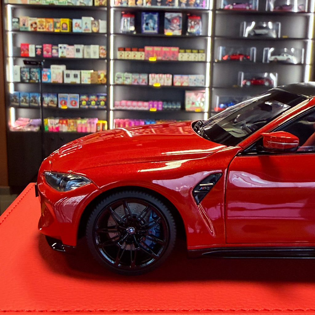 BMW M4 2024 v metalicky červené barvě v měřítku 1:18 od Minichamps