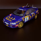 Subaru Impreza 555 Rallye Monte Carlo 1995, vůz č. 5, Carlos Sainz, měřítko 1:18 s vitrínou od Kyosho