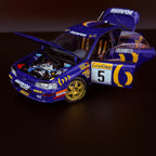 Subaru Impreza 555 Rallye Monte Carlo 1995, vůz č. 5, Carlos Sainz, měřítko 1:18 s vitrínou od Kyosho