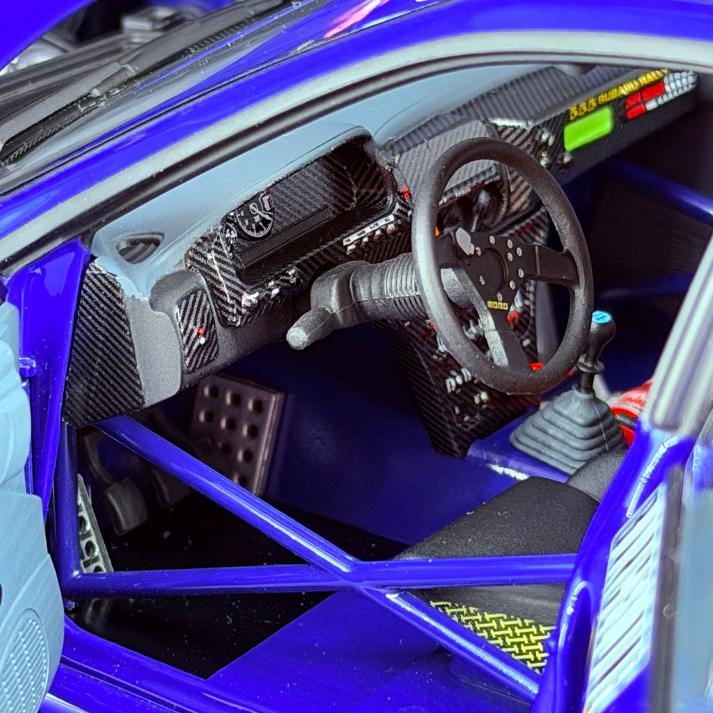Subaru Impreza 555 Rallye Monte Carlo 1995, vůz č. 5, Carlos Sainz, měřítko 1:18 s vitrínou od Kyosho