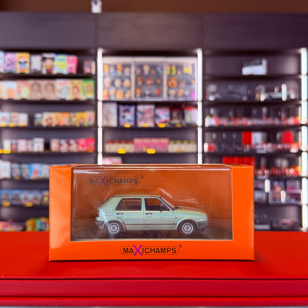 Volkswagen Golf II 4dveřový 1985 stříbrná metalická zelená 1:43 od Maxichamps