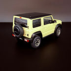 Suzuki Jimny Sierra JB74 – Chiffon Ivory Metallic / Black Roof im Maßstab 1:18 von AUTOart