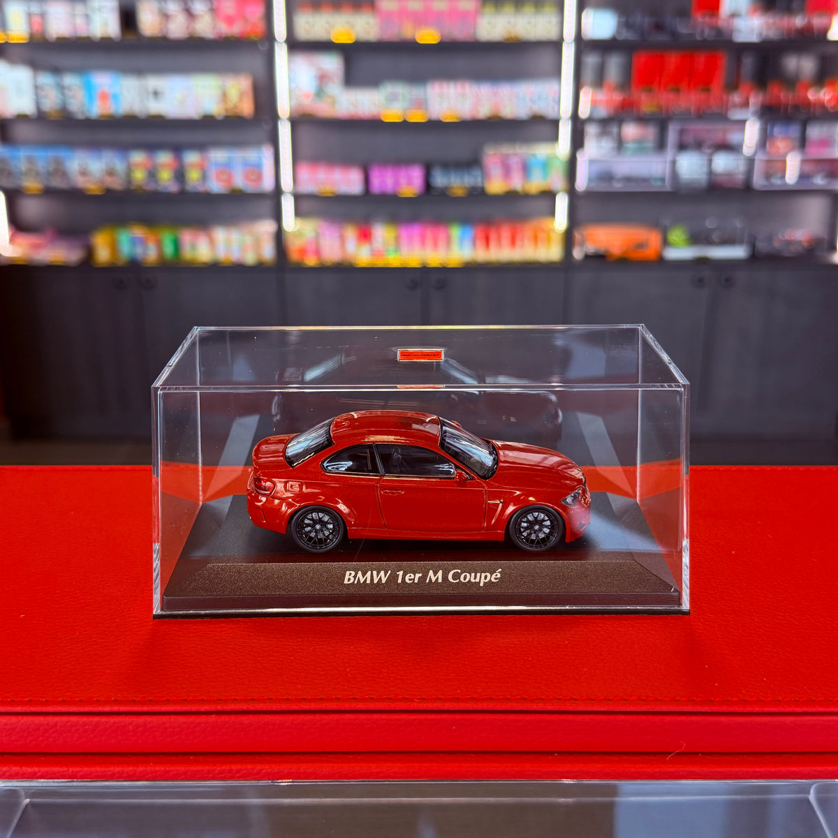 BMW 1. řady M Coupé (E82) 2011 oranžová metalíza 1:43 od Maxichamps