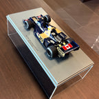 Wolf WR1, vítěz Velké ceny Monaka 1977, Jody Scheckter, měřítko 1:18 s vitrínou od Spark Models